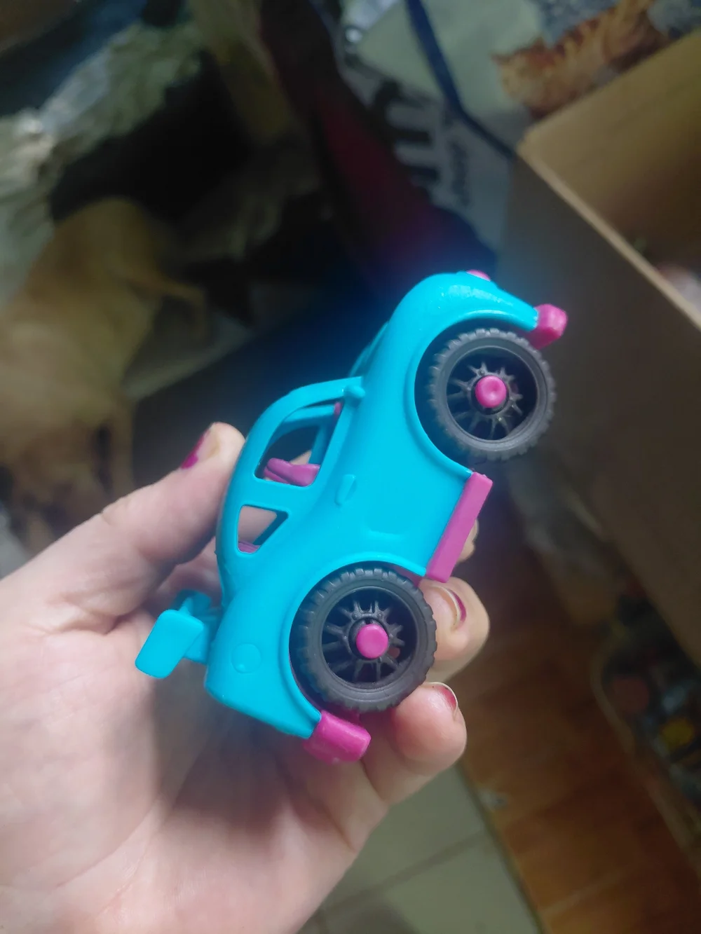 B. toys Happy Cruisers mini race car featuring a vibrant blue body with contrast